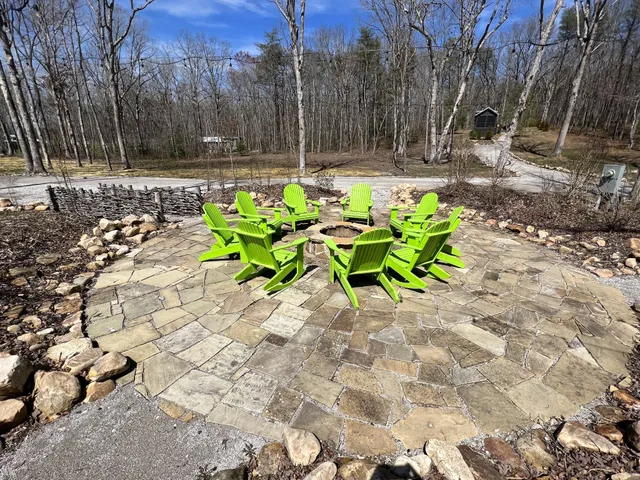 a view of a wooden house with a yard