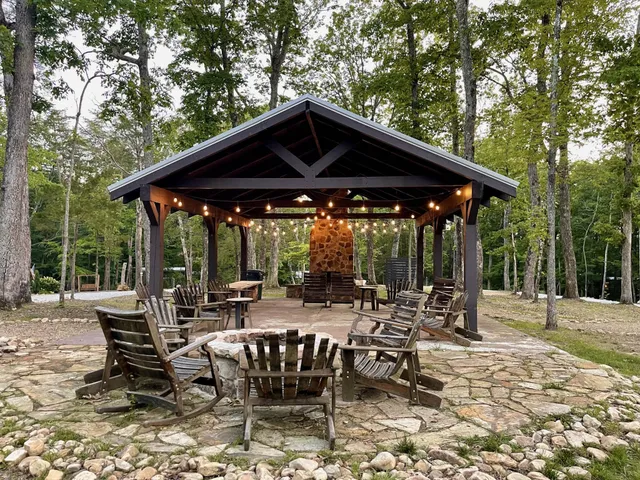 a view of a yard with large trees