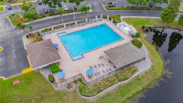 an aerial view of a house with a swimming pool