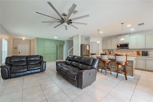 a view of kitchen with sink and microwave