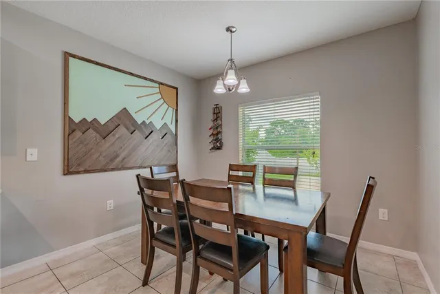 a bathroom with a granite countertop tub sink and mirror