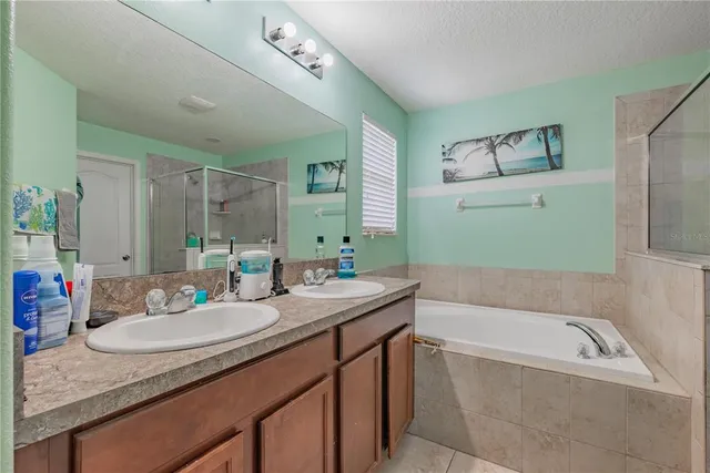 a bathroom with a shower and a sink