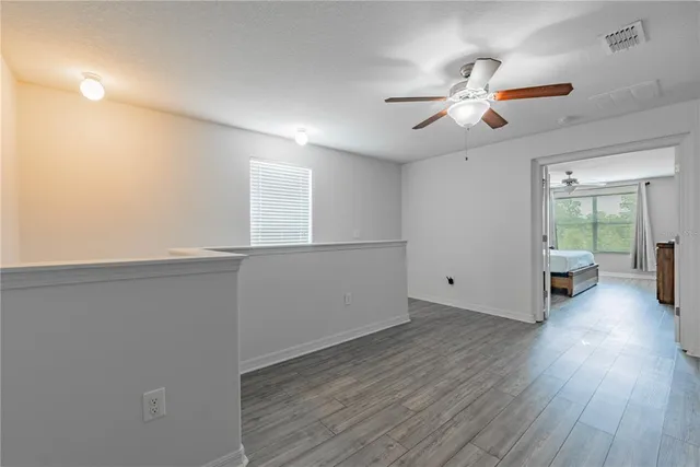 a view of kitchen with sink and microwave