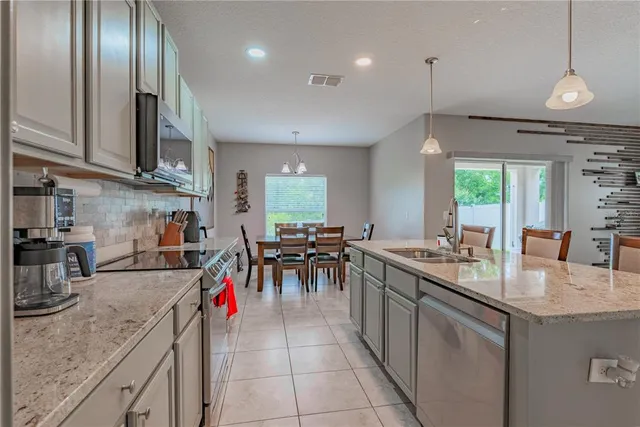 a bathroom with a sink mirror and toilet