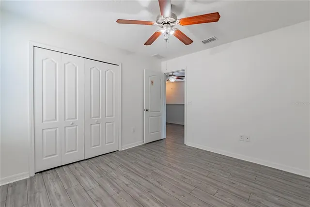 a dining room with furniture a chandelier and window