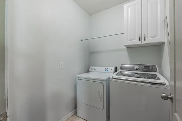 a front view of a house with a garden and yard