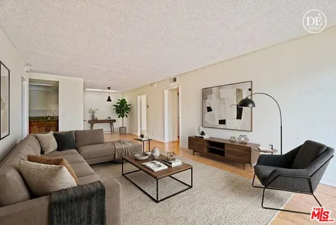 a living room with furniture and a table