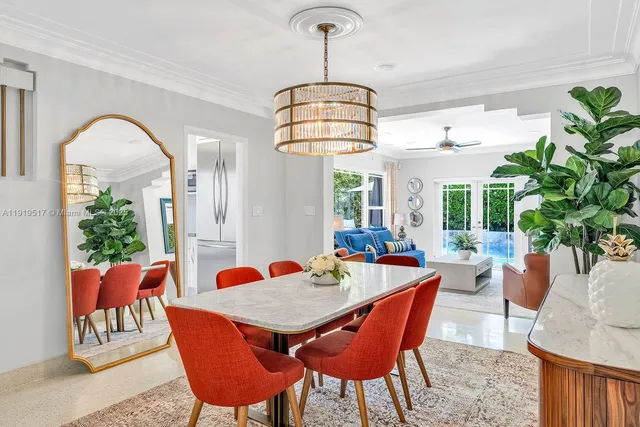 a kitchen with stainless steel appliances a stove a sink cabinets and wooden floor