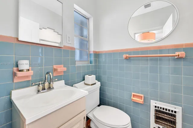 a bedroom with a bed and a table in it