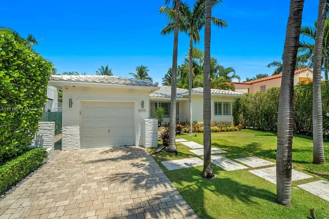a potted plant sitting in front of a house