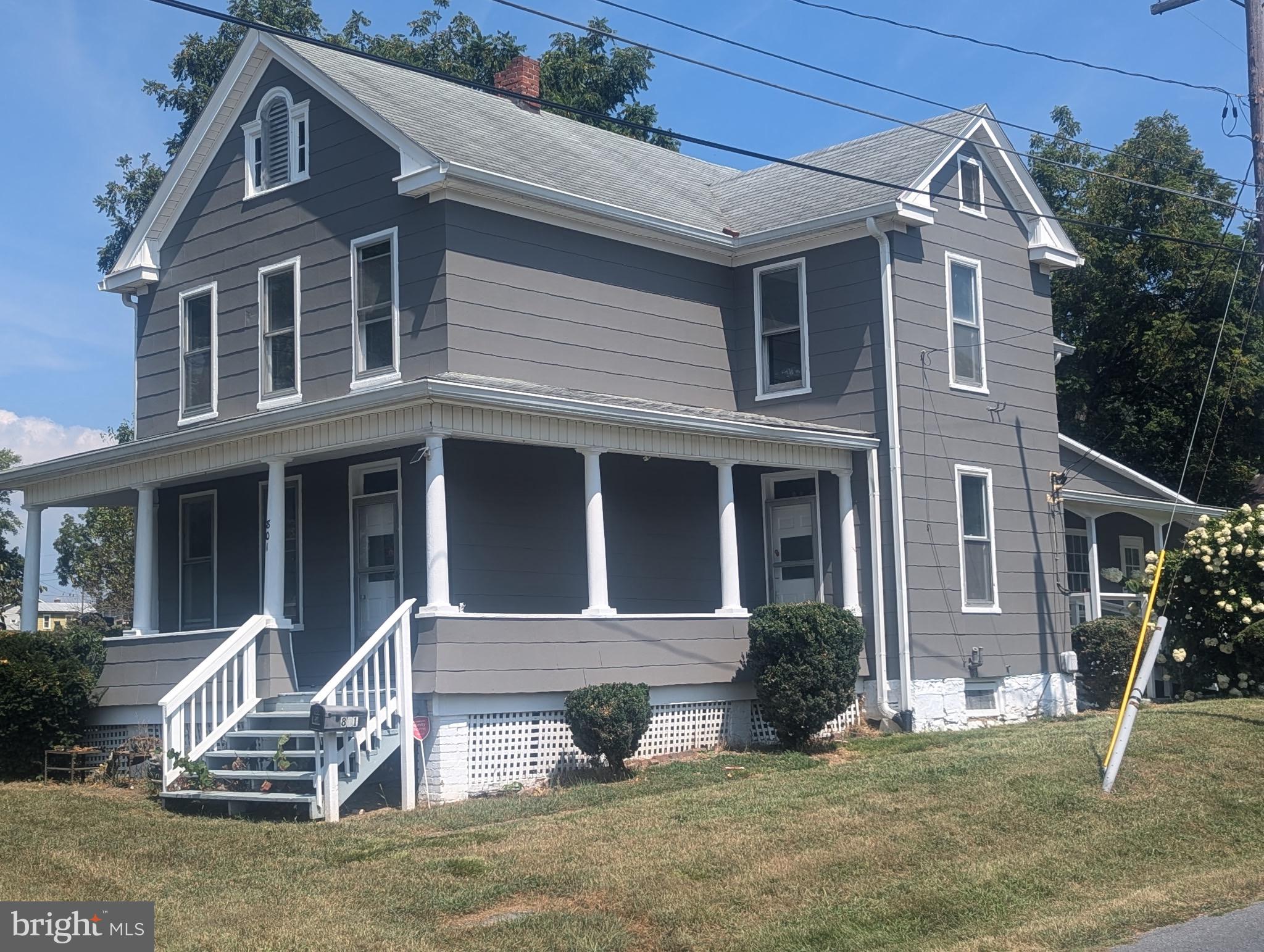 801 East Moler Avenue Martinsburg, WV 25404 - Photo 1 of 19 a front view of a house with garden
