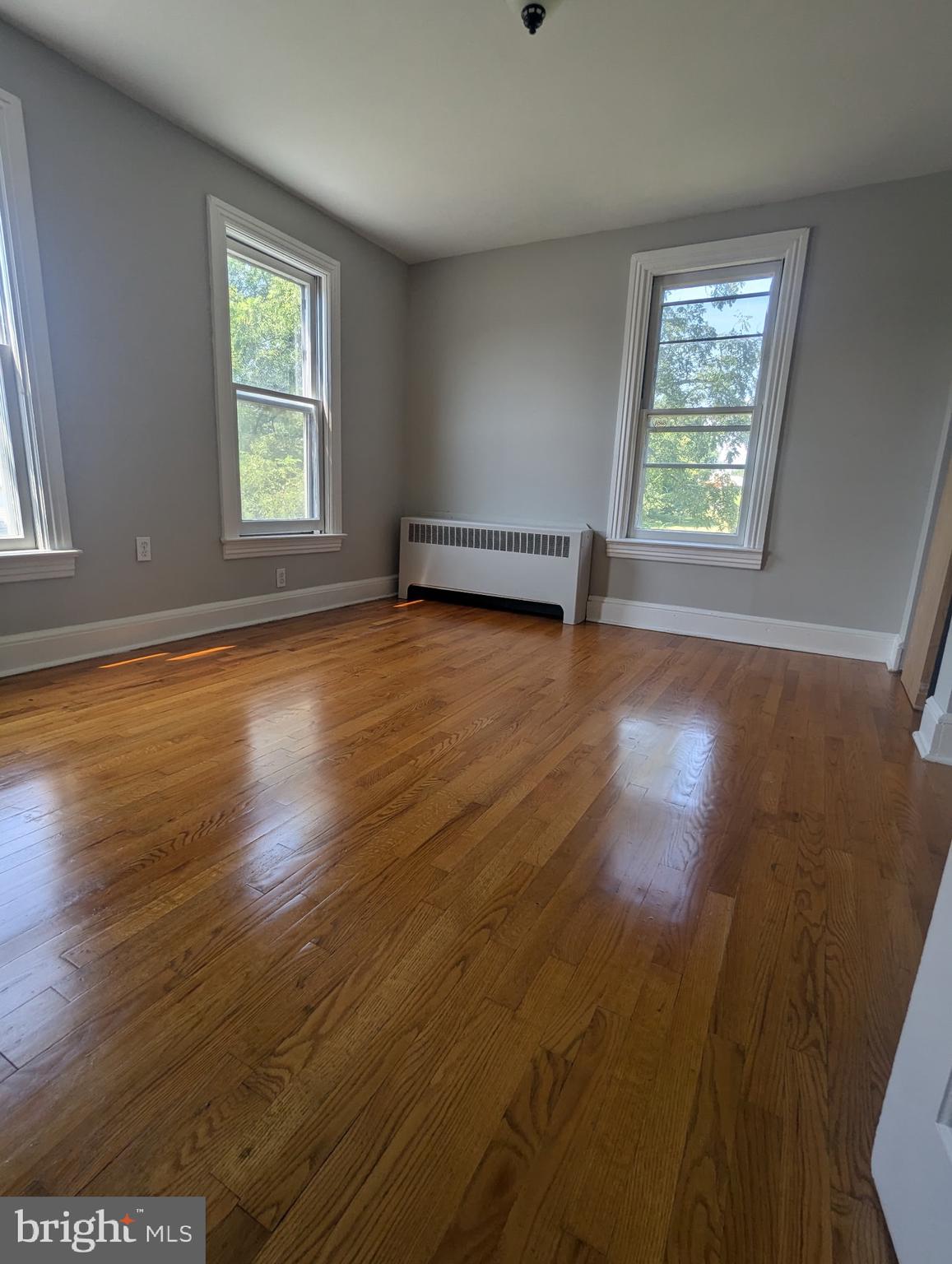 801 East Moler Avenue Martinsburg, WV 25404 - Photo 17 of 19 an empty room with wooden floor and windows