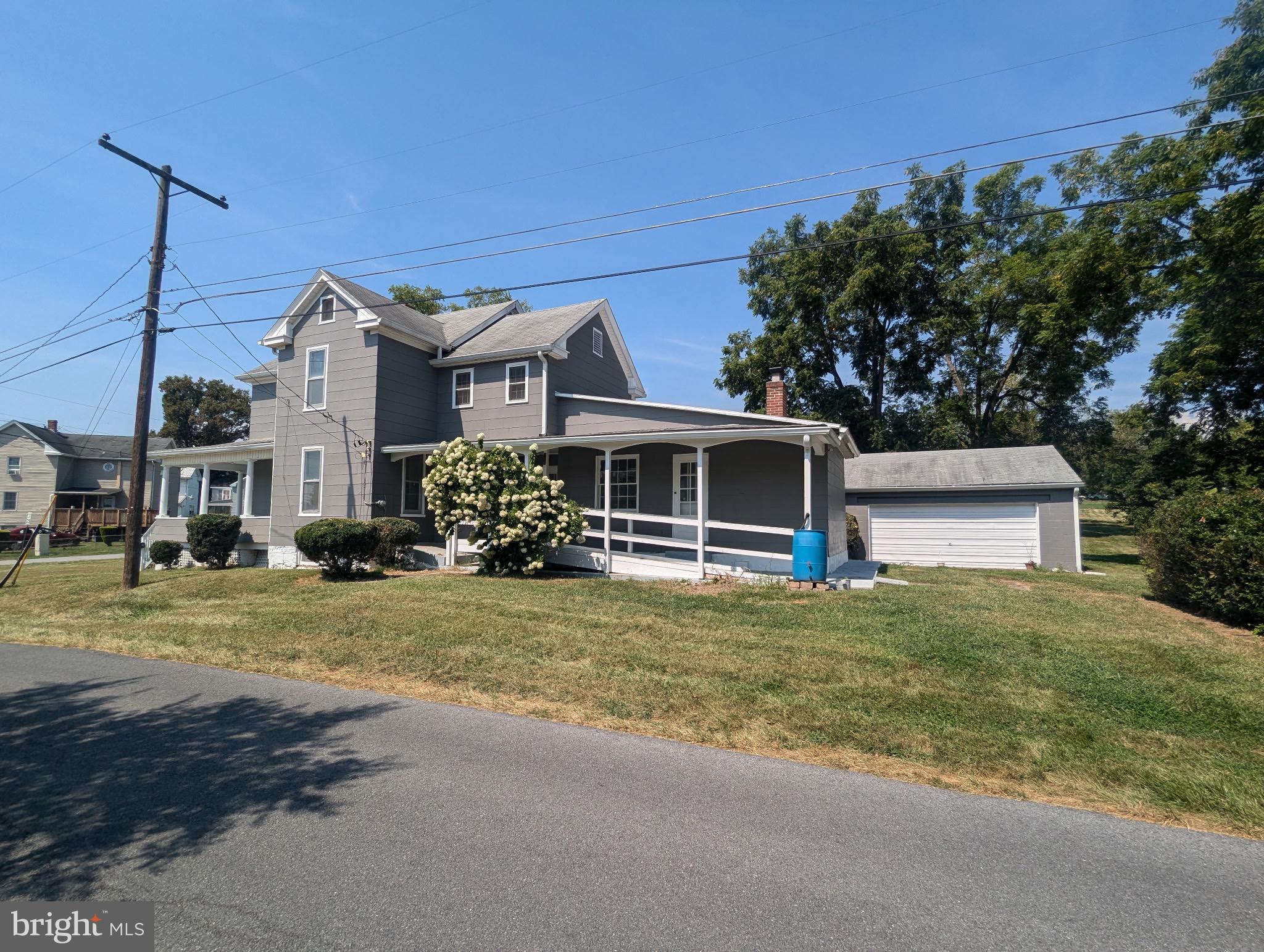 801 East Moler Avenue Martinsburg, WV 25404 - Photo 2 of 19 a front view of a house with a garden