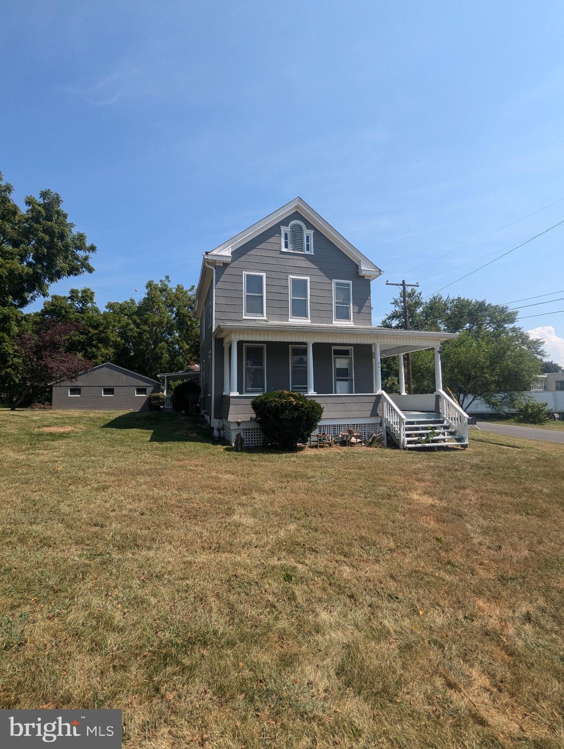 801 East Moler Avenue Martinsburg, WV 25404 - Photo 3 of 19 a front view of a house with a garden