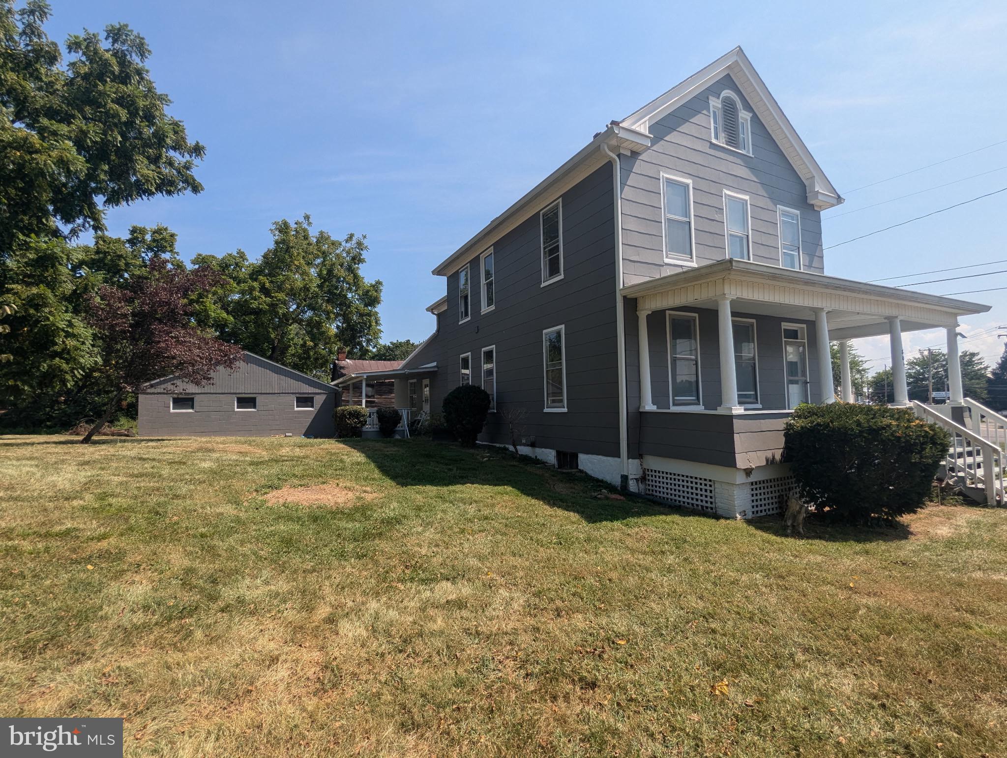 801 East Moler Avenue Martinsburg, WV 25404 - Photo 4 of 19 a front view of a house with a yard