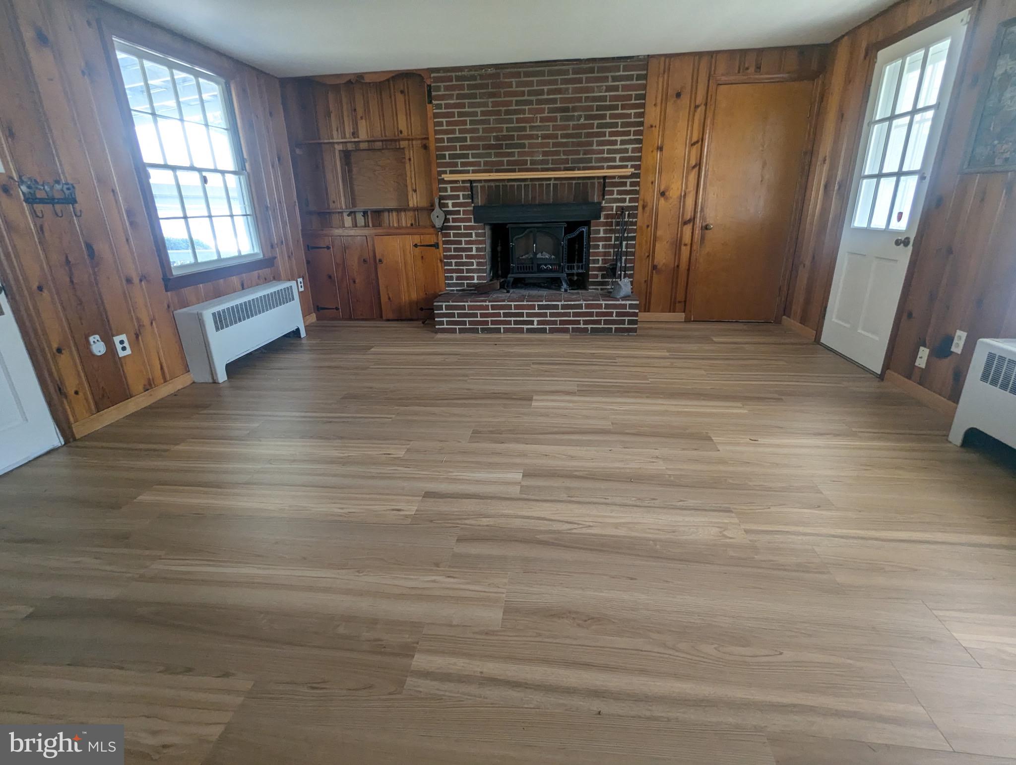 801 East Moler Avenue Martinsburg, WV 25404 - Photo 5 of 19 a view of an empty room with a window and fireplace