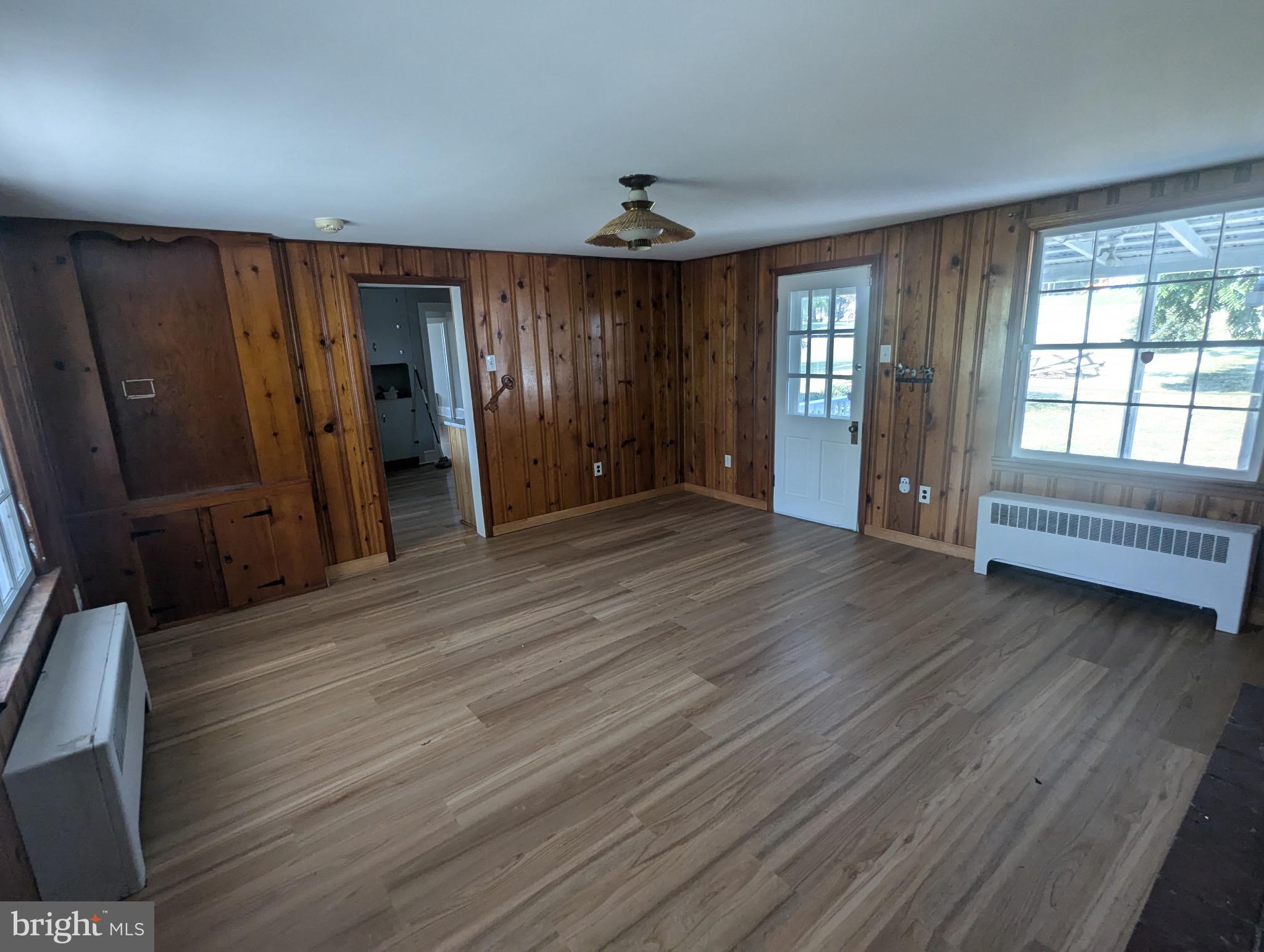 801 East Moler Avenue Martinsburg, WV 25404 - Photo 6 of 19 wooden floor in an empty room with a window