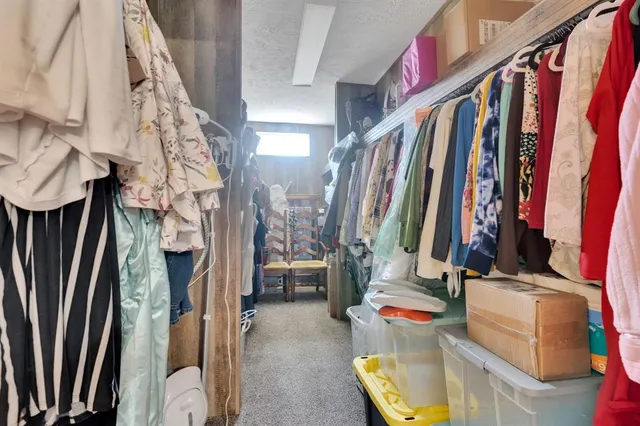 a bathroom with a sink vanity granite tub and a mirror