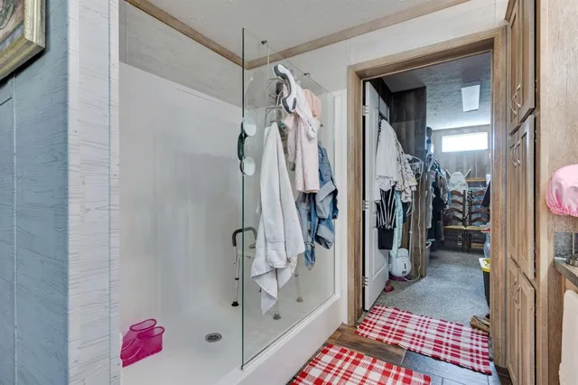 a bathroom with a bathtub sink and mirror