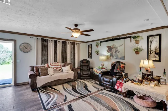 a view of a dining table chairs and chandelier