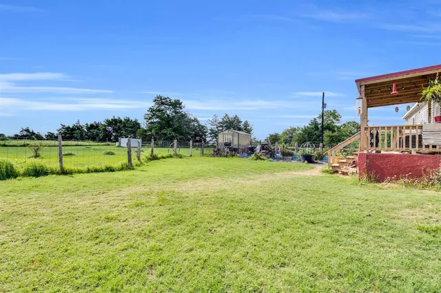 a view of a yard with an ocean view