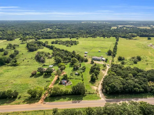 an aerial view of residential building with ocean view