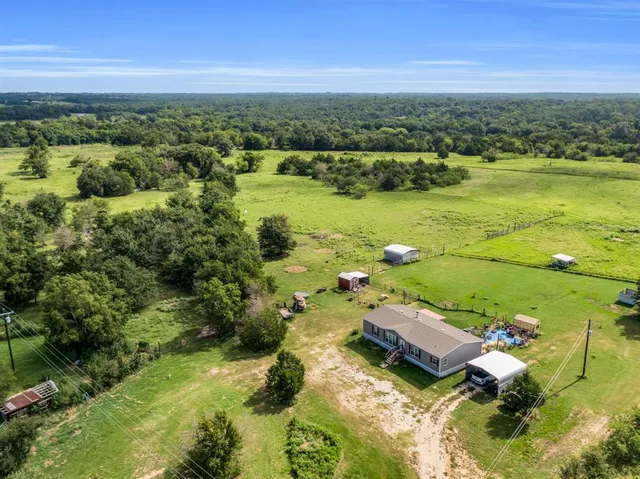 a view of yard with swimming pool