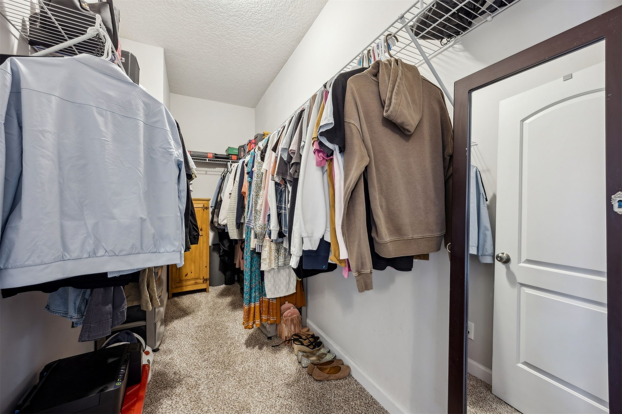 96718 Blackrock Road Yulee, FL 32097 - Photo 37 of 54 a view of walk in closet with clothes and shoes