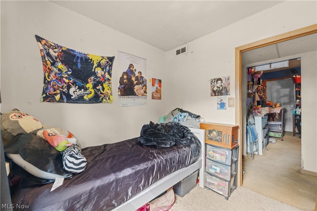 68-70 East Sunset Drive Rittman, OH 44270 - Photo 40 of 49 Carpeted room with a built-in closet