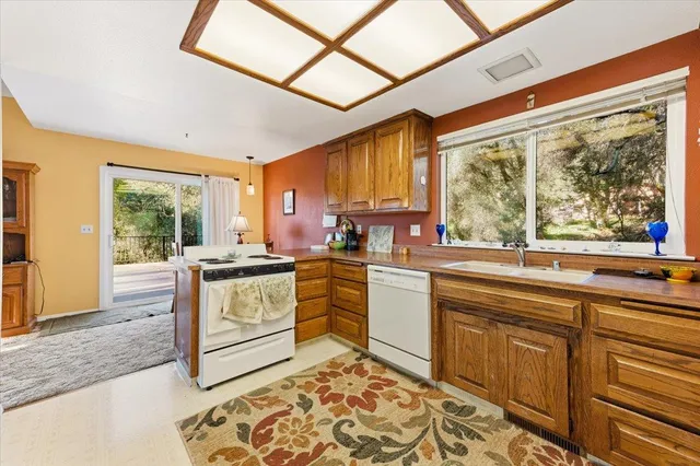 a view of a hallway with washer and dryer