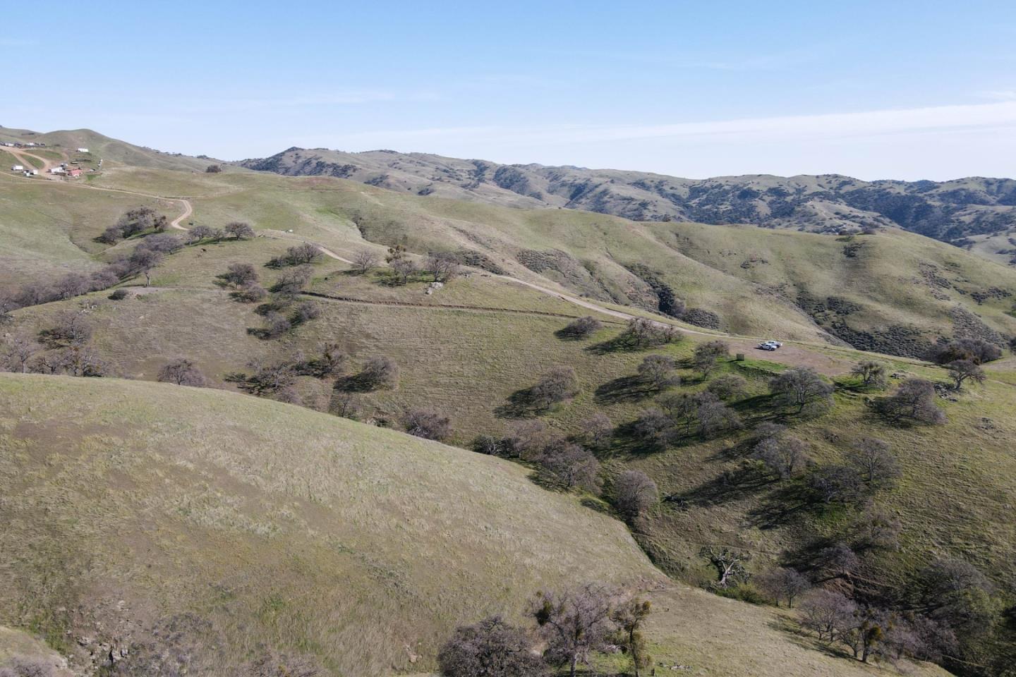 20041 Panoche Road Paicines, CA 95043 - Photo 4 of 10 a view of a dry yard with mountains in the background