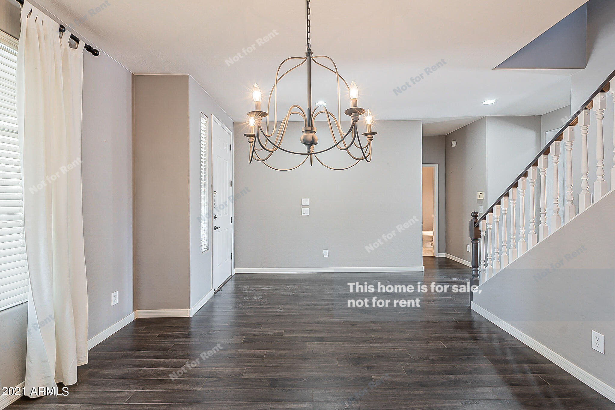 4639 East Timberline Road Gilbert, AZ 85297 - Photo 14 of 33 a view of a hallway with wooden floor and staircase