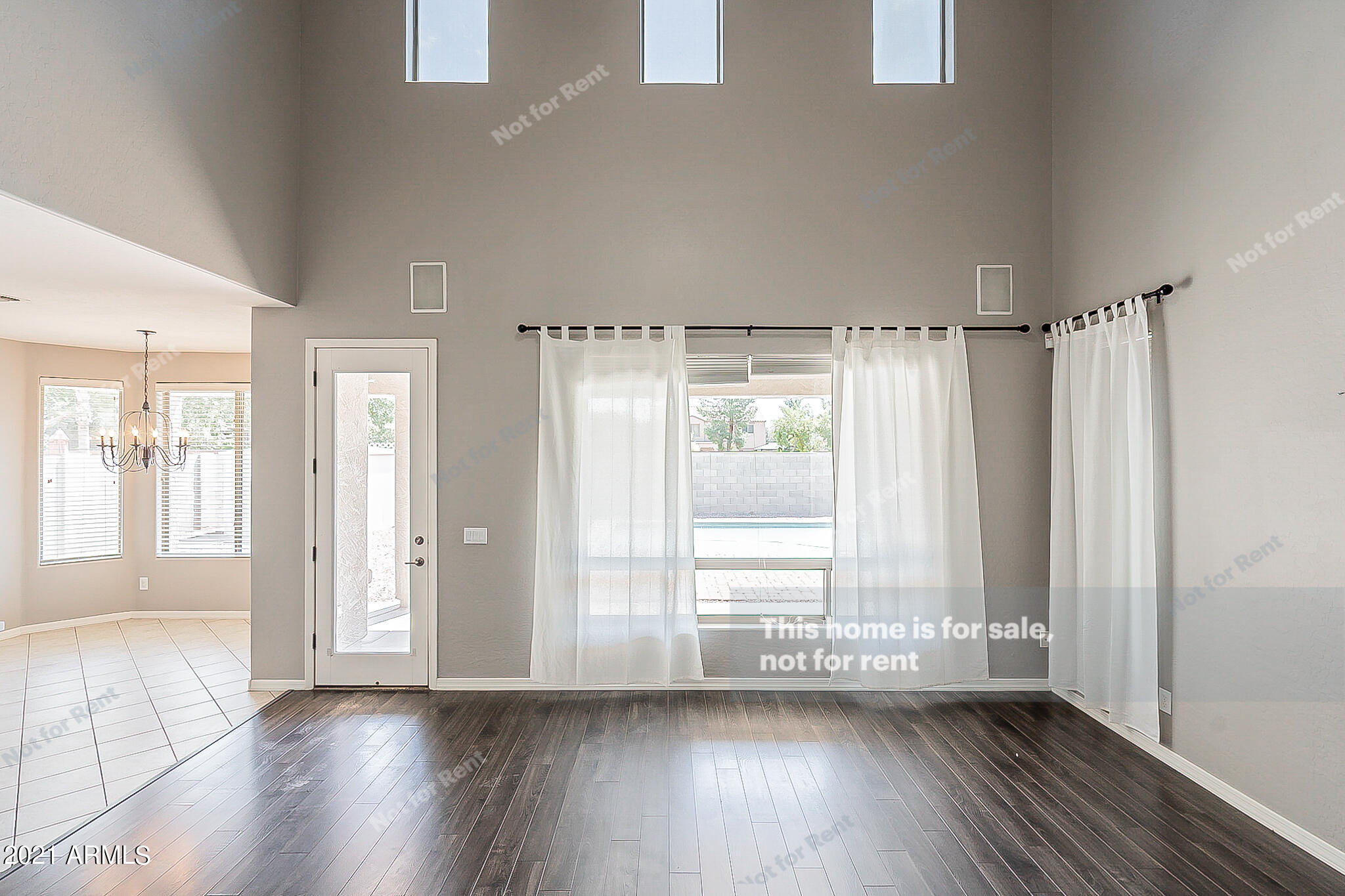 4639 East Timberline Road Gilbert, AZ 85297 - Photo 16 of 33 a view of an empty room with wooden floor and a window