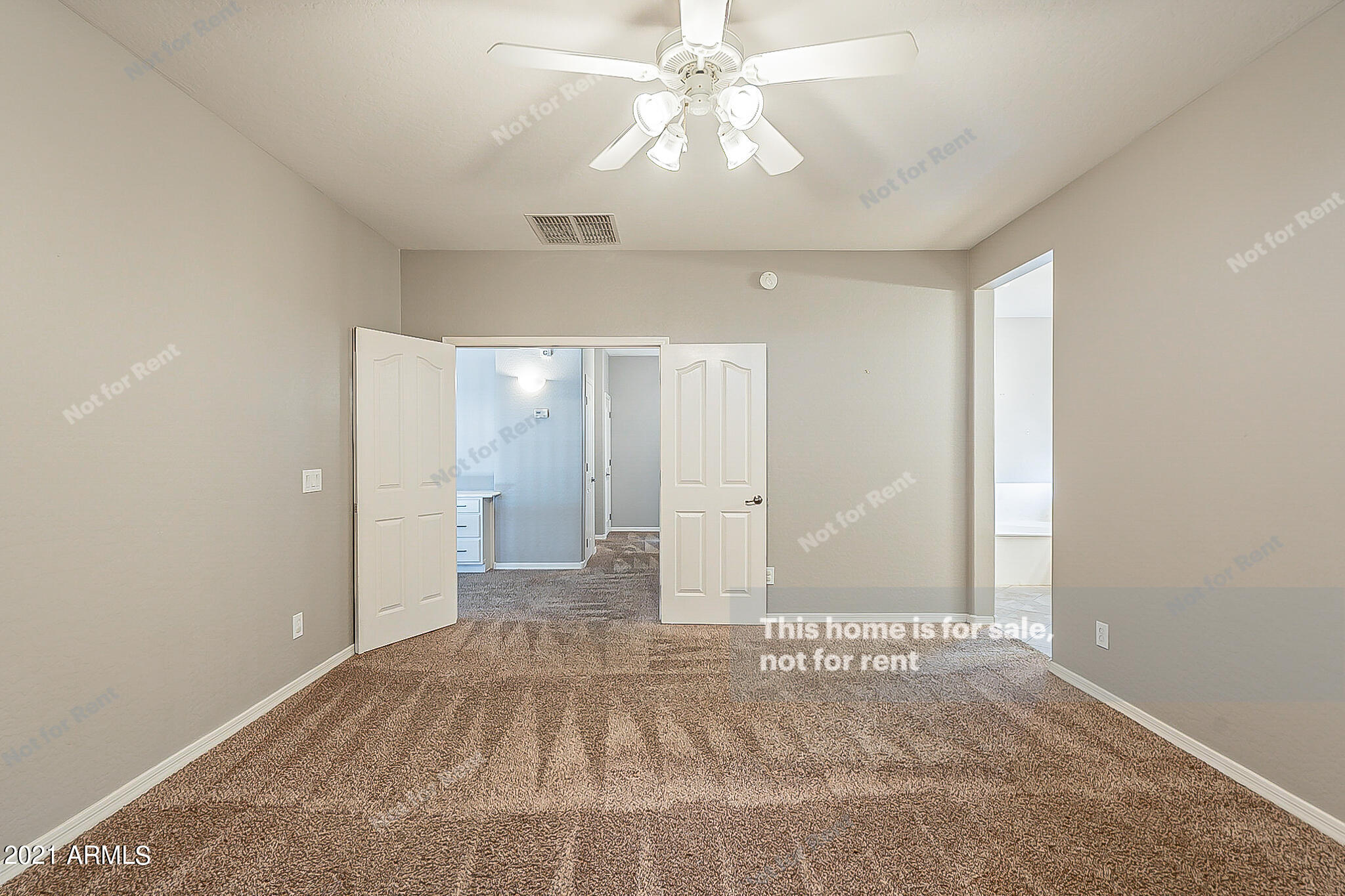 4639 East Timberline Road Gilbert, AZ 85297 - Photo 18 of 33 a view of a big room with windows and chandelier fan