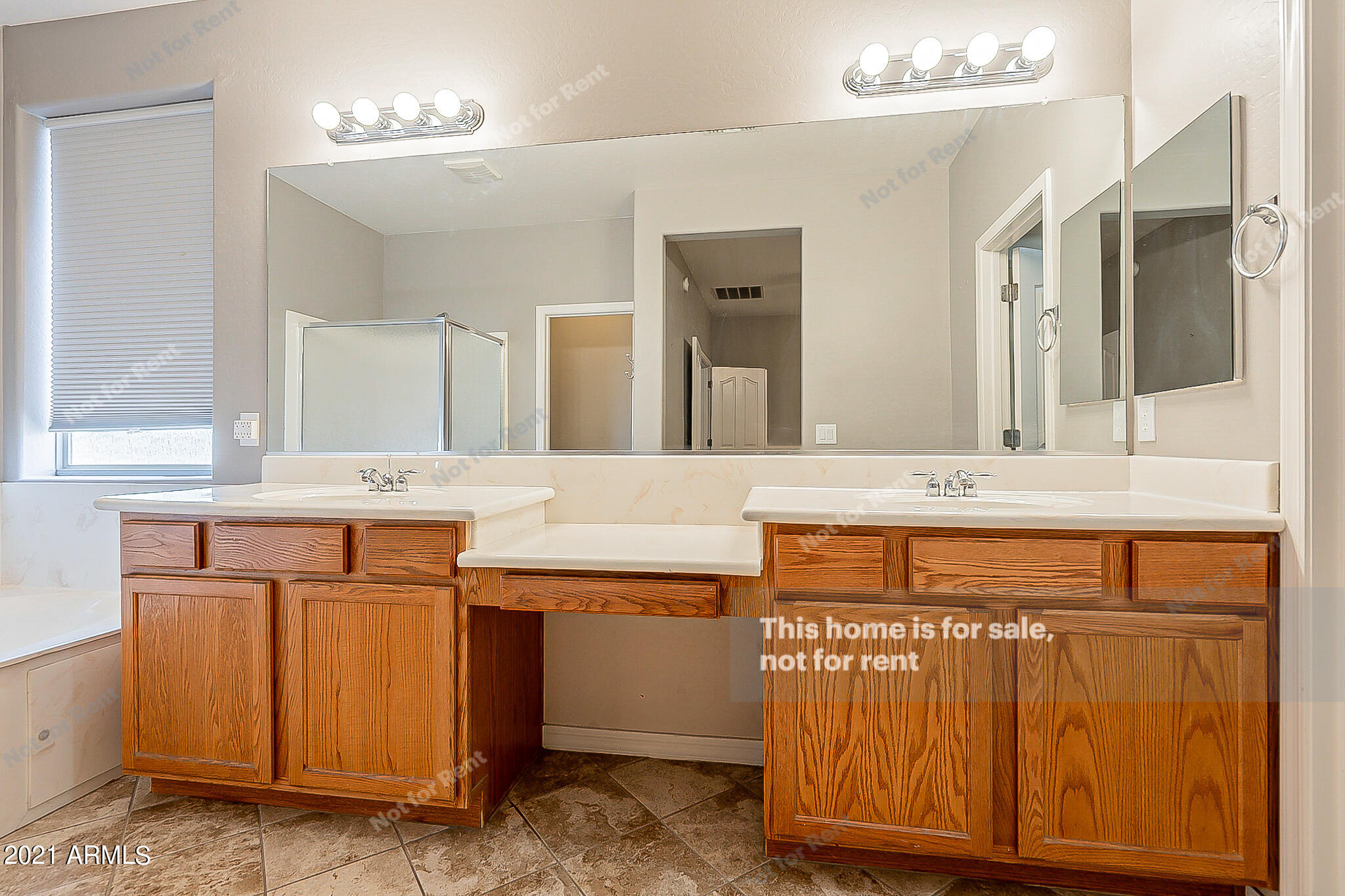 4639 East Timberline Road Gilbert, AZ 85297 - Photo 28 of 33 a bathroom with a sink and a mirror