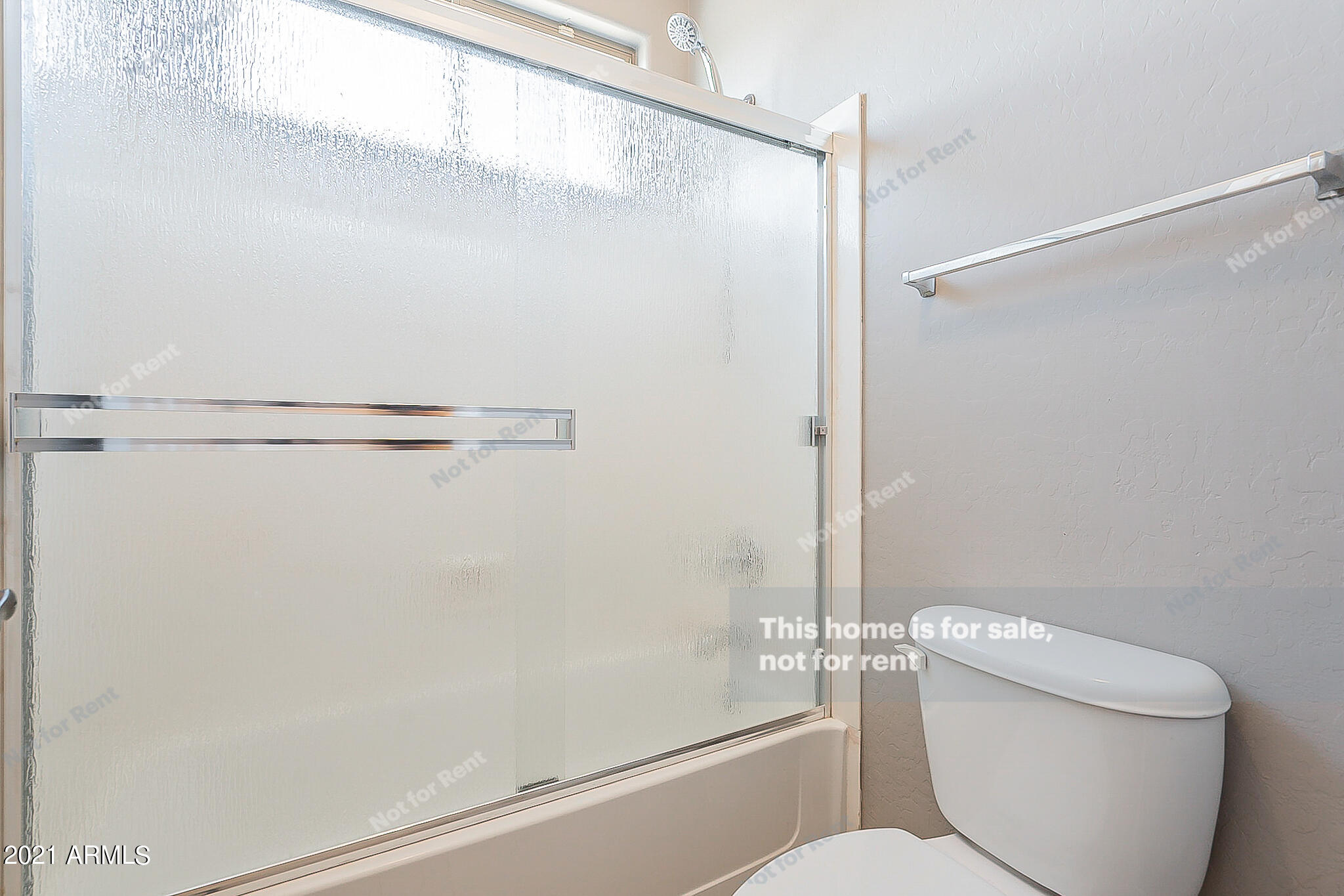 4639 East Timberline Road Gilbert, AZ 85297 - Photo 30 of 33 a bathroom with a toilet and a shower