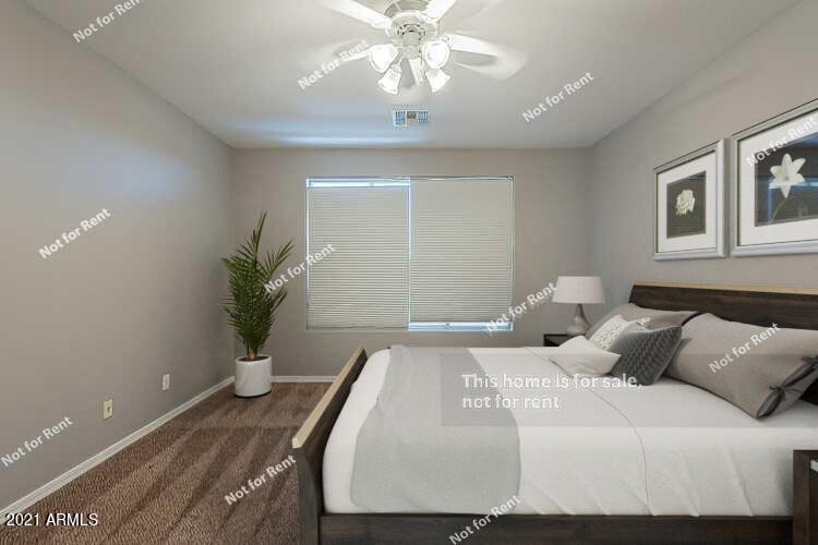 4639 East Timberline Road Gilbert, AZ 85297 - Photo 3 of 33 a bedroom with a bed and a potted plant