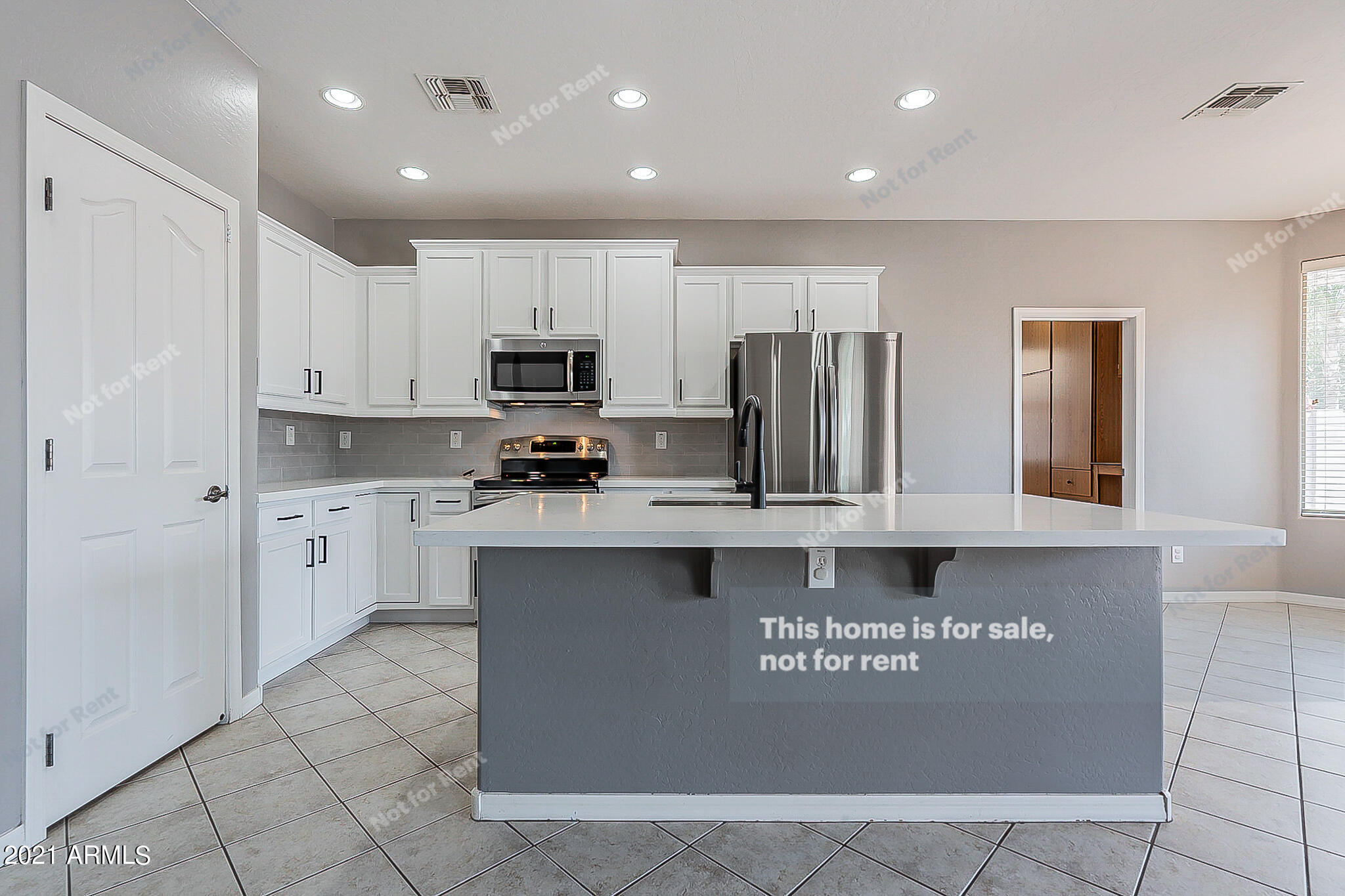 4639 East Timberline Road Gilbert, AZ 85297 - Photo 4 of 33 a kitchen with stainless steel appliances granite countertop a refrigerator a stove top oven a sink and dishwasher