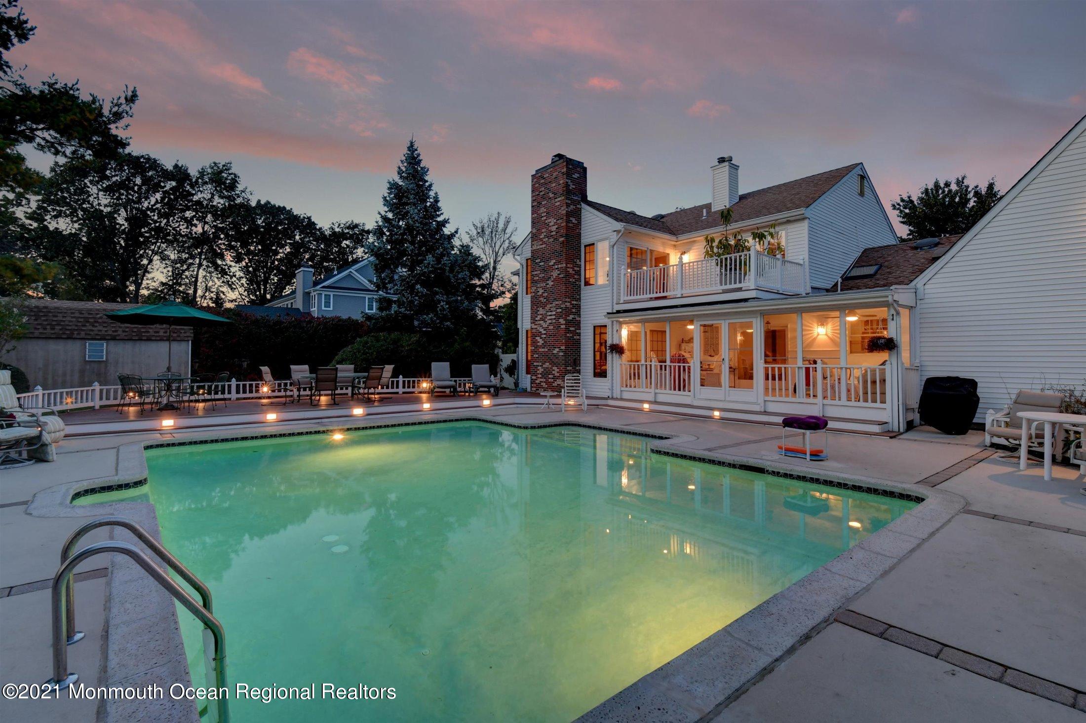 130 Lippincott Road Little Silver, NJ 07739 - Photo 2 of 7 swimming pool view with a seating space and a garden