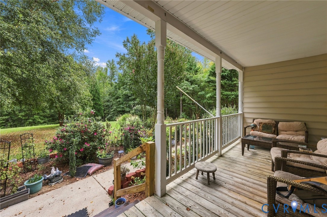 133 Ford Road Bumpass, VA 23024 - Photo 46 of 55 Expansive covered porch with wood-finish decking a