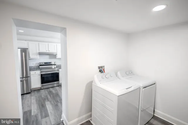a kitchen with a sink and stainless steel appliances
