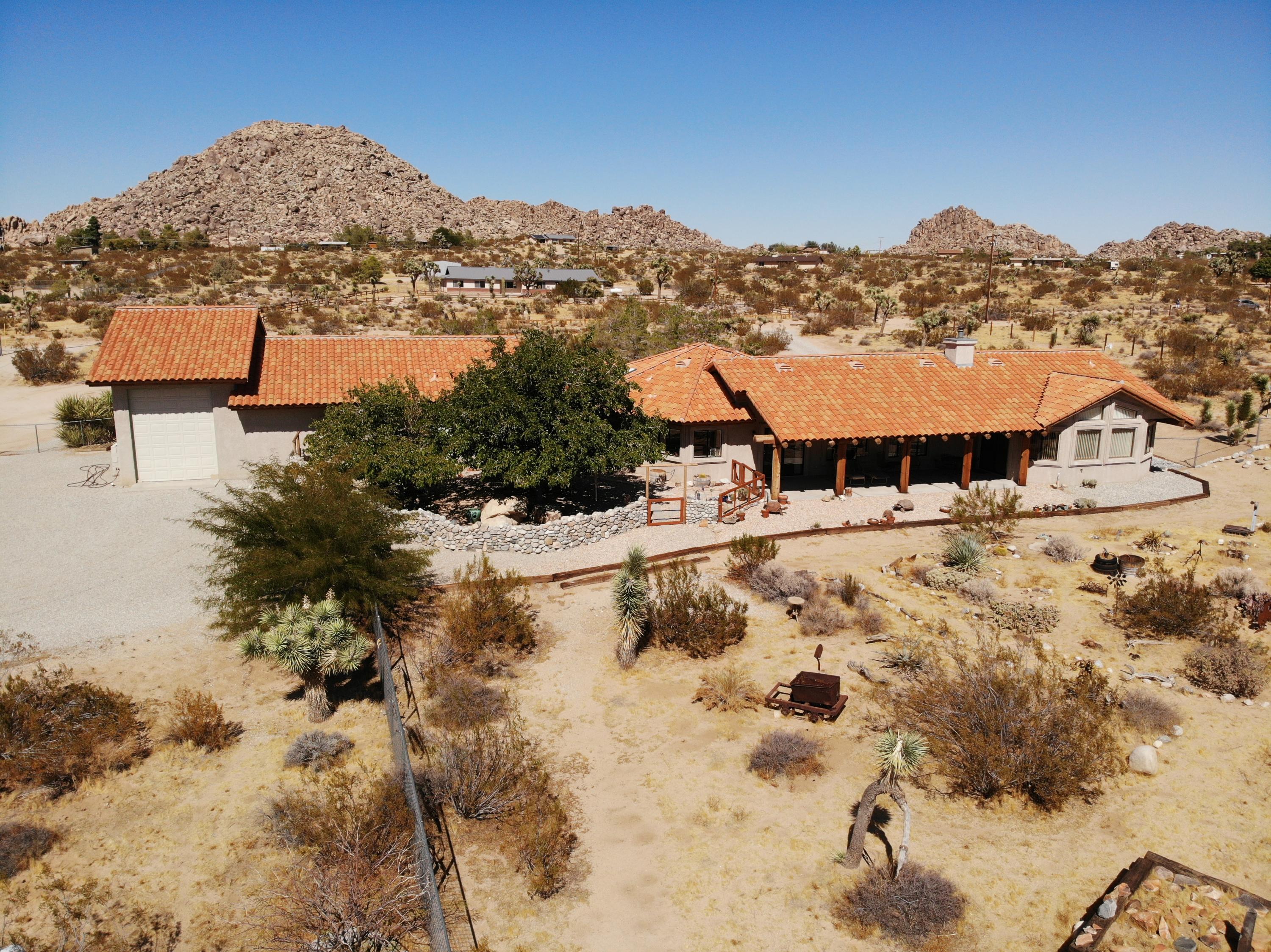 63533 Wagon Wheel Road Joshua Tree, CA 92252 - Photo 1 of 62 a view of houses with a road