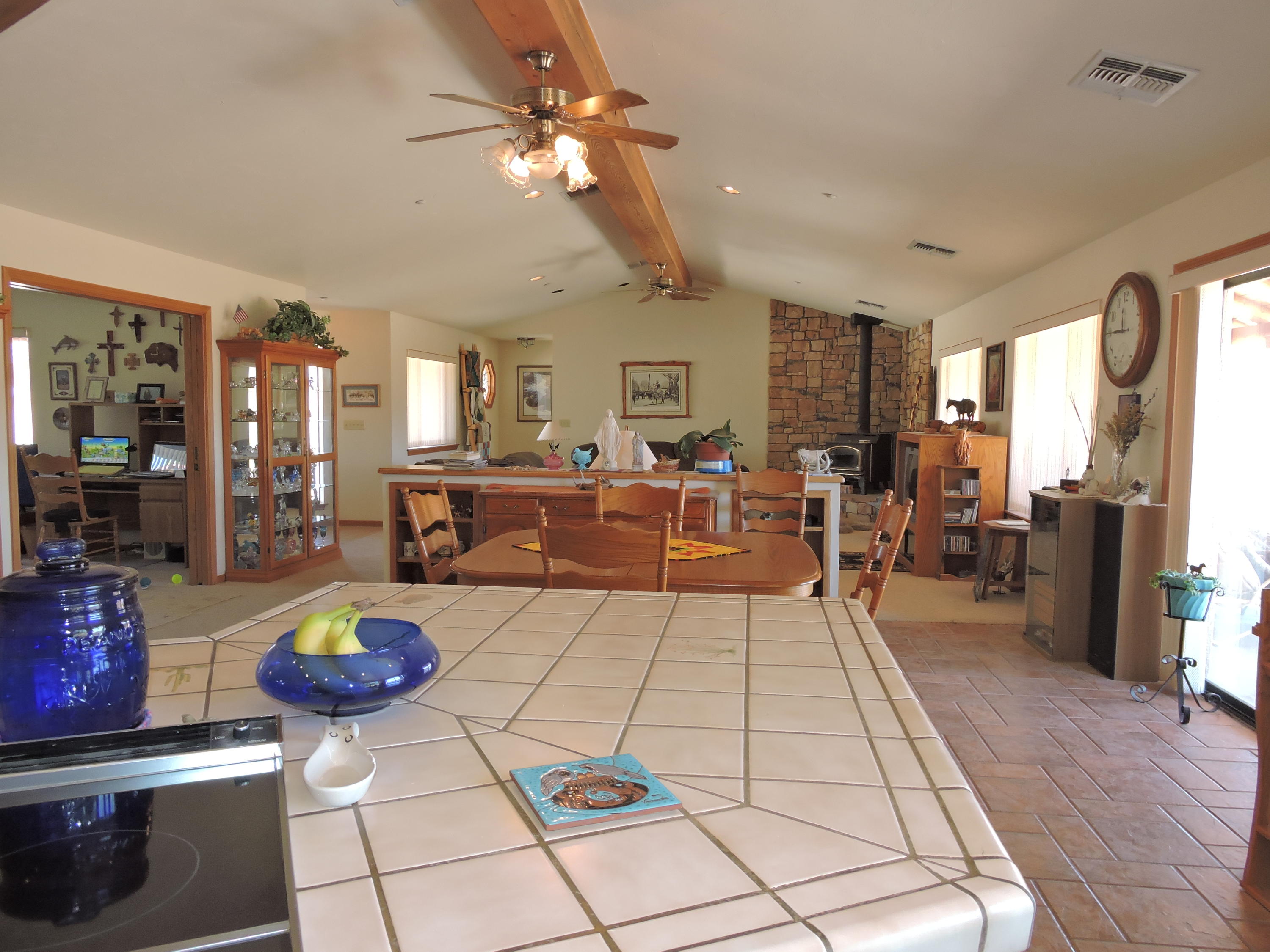 63533 Wagon Wheel Road Joshua Tree, CA 92252 - Photo 12 of 62 a living room with fireplace furniture and a flat screen tv