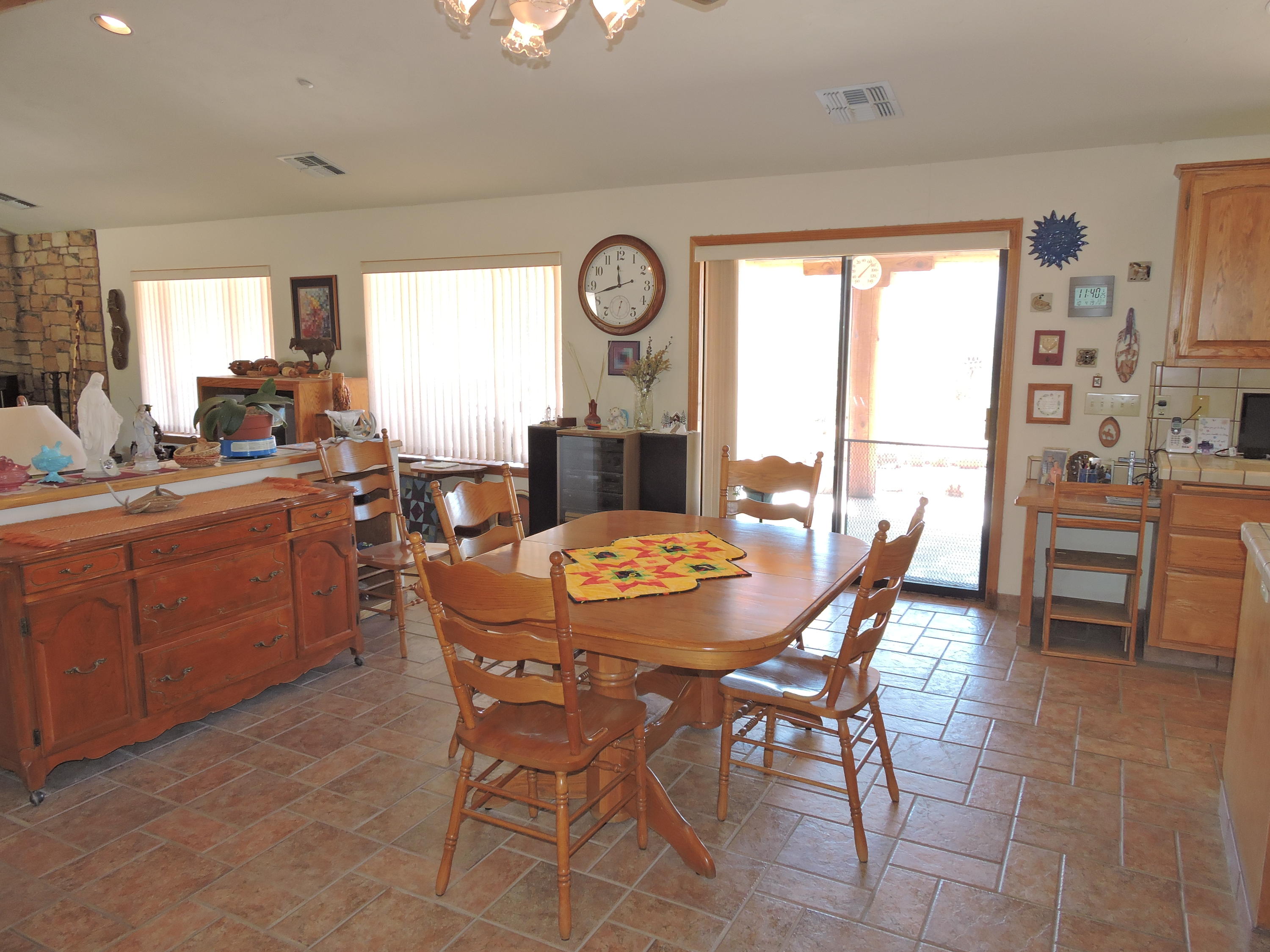 63533 Wagon Wheel Road Joshua Tree, CA 92252 - Photo 13 of 62 a view of a dining room with furniture and window