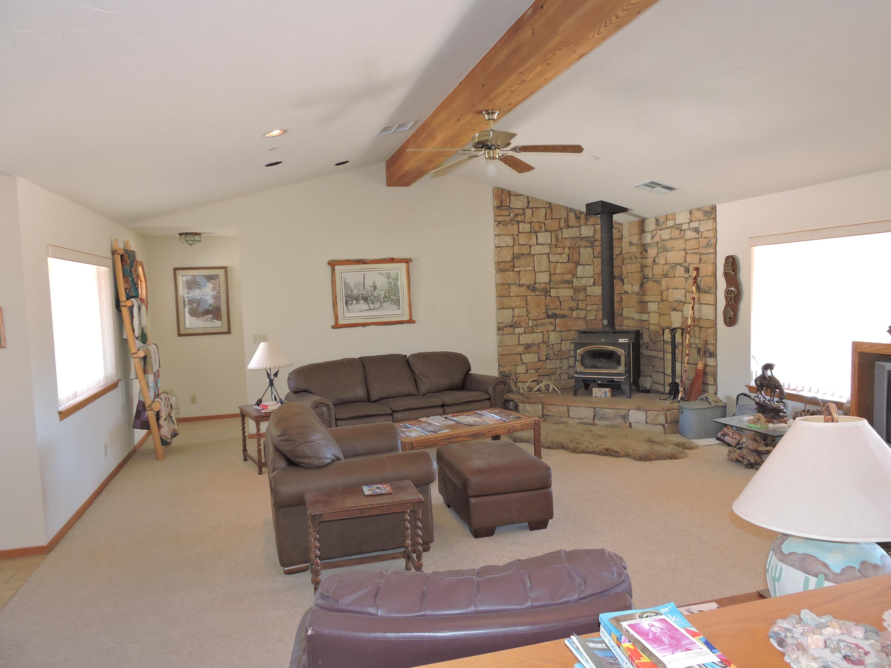 63533 Wagon Wheel Road Joshua Tree, CA 92252 - Photo 15 of 62 a living room with furniture and a fireplace