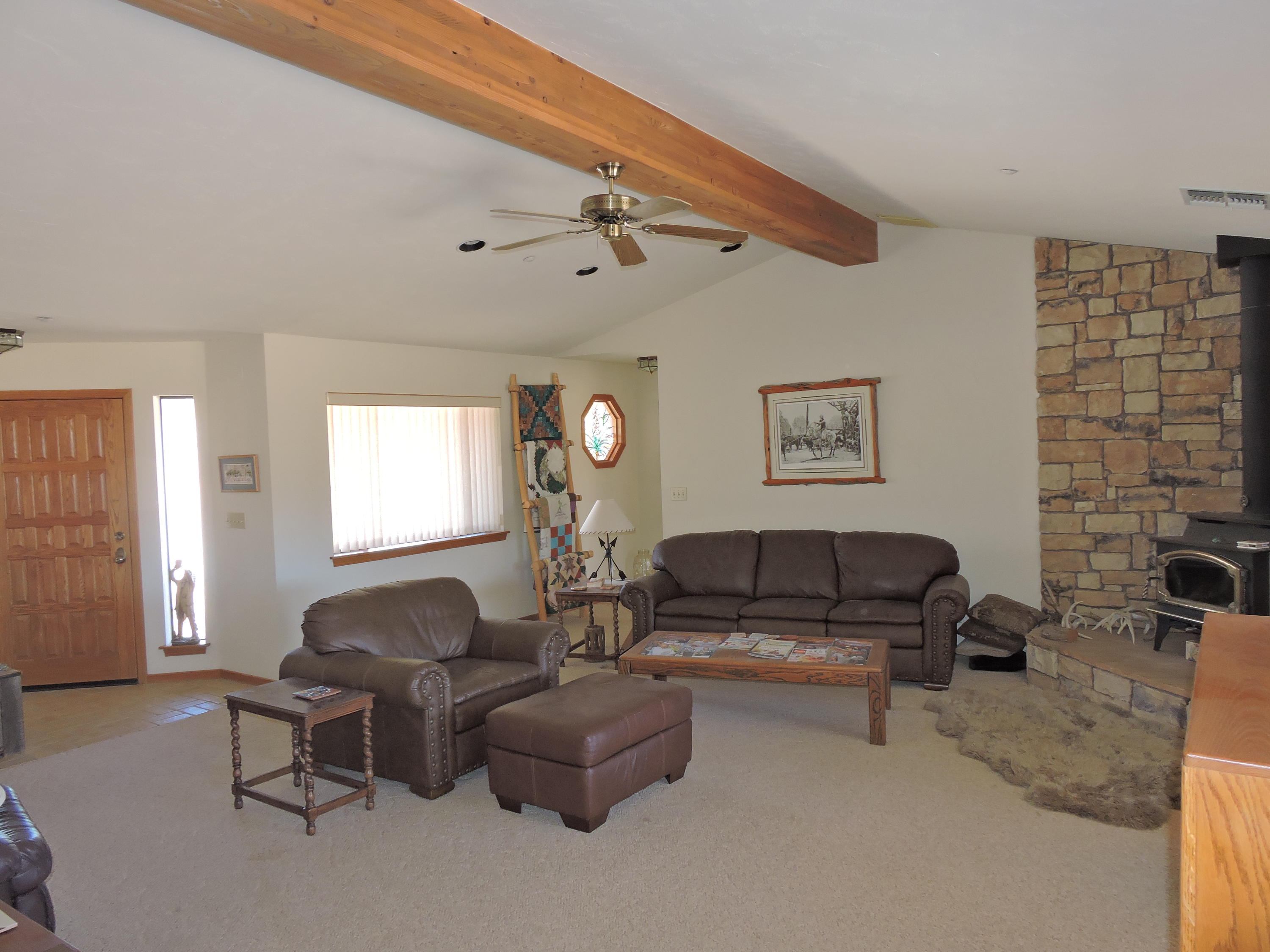 63533 Wagon Wheel Road Joshua Tree, CA 92252 - Photo 16 of 62 a living room with furniture and a window