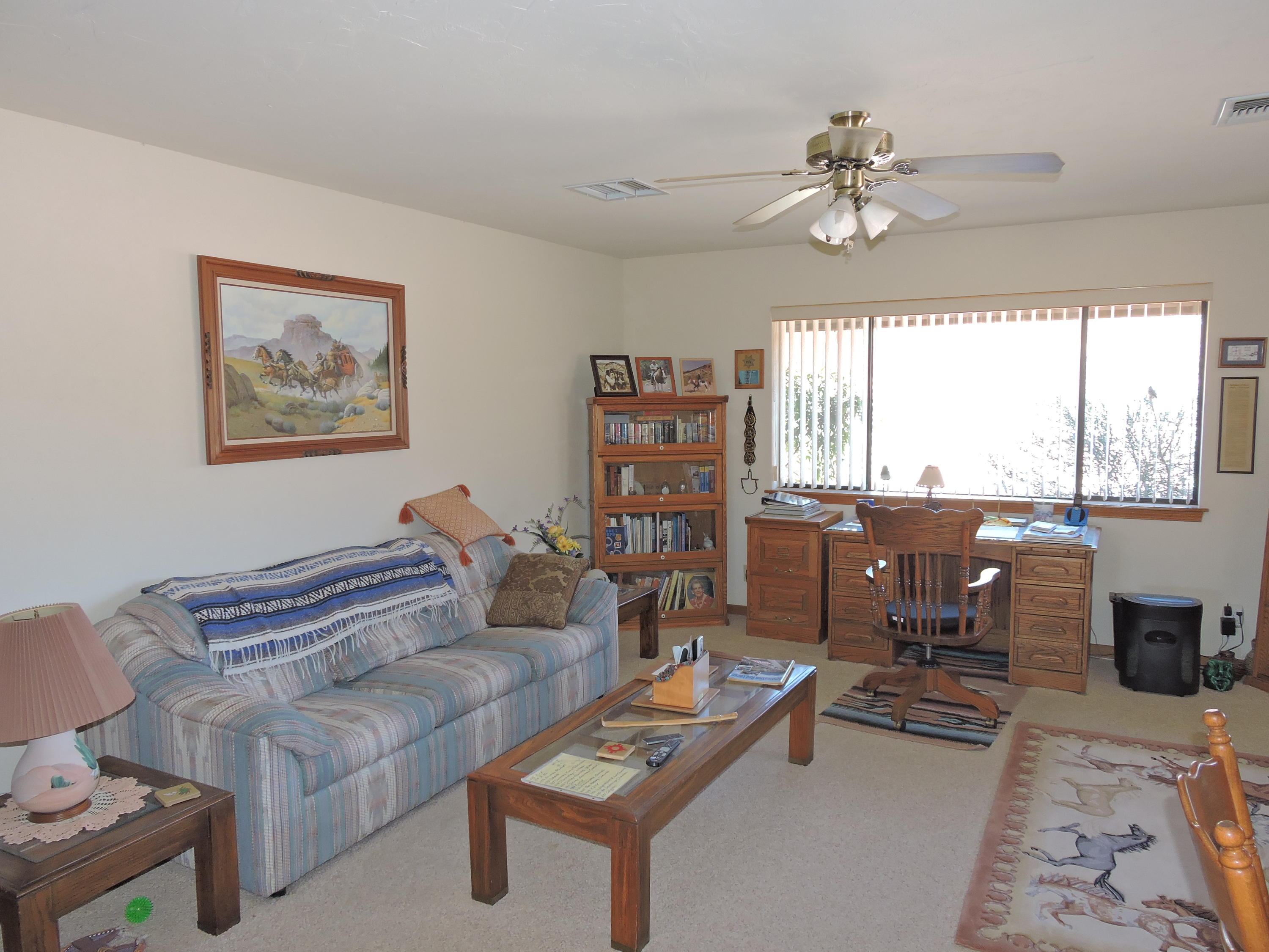 63533 Wagon Wheel Road Joshua Tree, CA 92252 - Photo 17 of 62 a living room with furniture and a large window