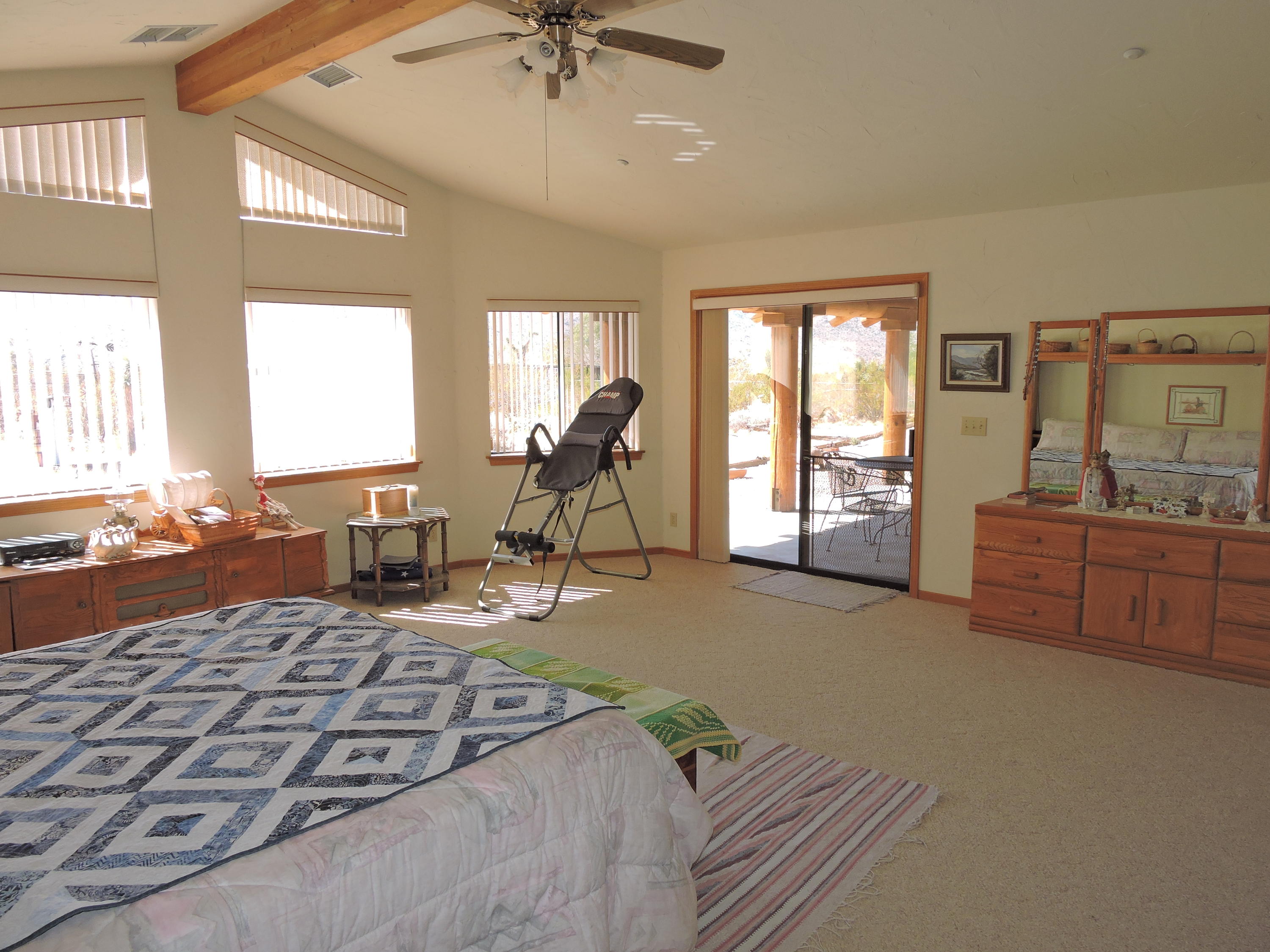 63533 Wagon Wheel Road Joshua Tree, CA 92252 - Photo 21 of 62 a living room with furniture and a flat screen tv