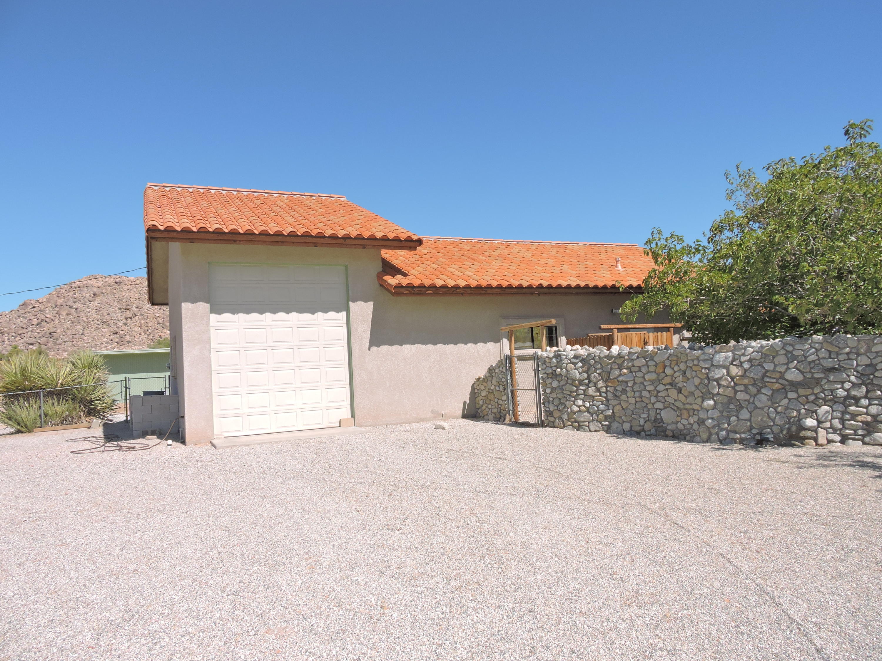 63533 Wagon Wheel Road Joshua Tree, CA 92252 - Photo 33 of 62 a view of a house with a outdoor space