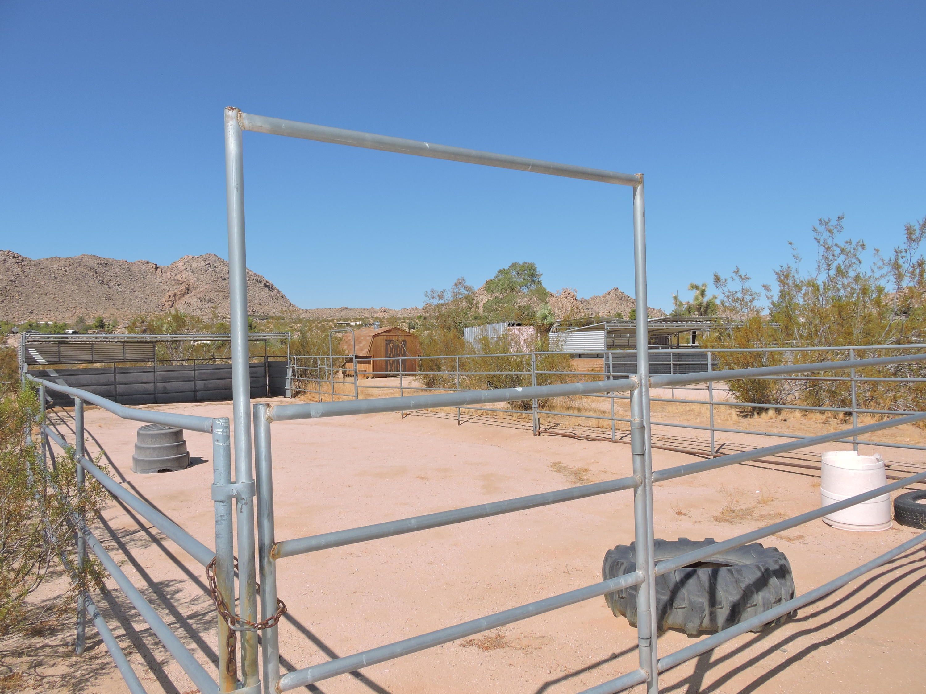 63533 Wagon Wheel Road Joshua Tree, CA 92252 - Photo 43 of 62 a view of a balcony with floor to ceiling windows with wooden floor